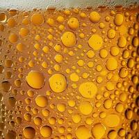 AI generated Ultra close up view of beer texture with foam photo