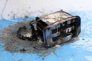 Toaster after fire. Household electrical appliance fire hazard photo