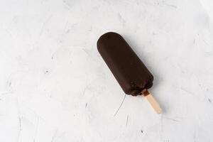 ice cream stick  on dark white background  covered chocolate sticks frozen Popsicle and Lolly sweet dessert  Flat lay photo