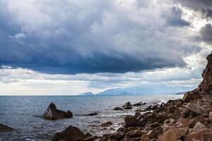 rock over the sea water photo