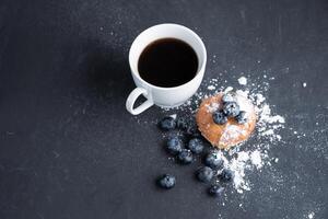 Blueberry antioxidant organic superfood and sweet muffin with cup of coffee photo