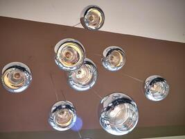 Modern ceiling lamps background, round lamps over ceiling pattern photo