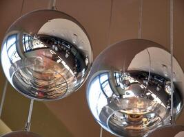 Modern ceiling lamps background, round lamps over ceiling pattern photo