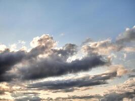 White fluffy clouds in the deep blue sky. Heaven background photo