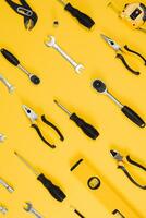 Set of various construction tools. Tools for home repair. Work at a construction site. On a yellow background. Flatly. Flatlay photo