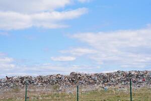 Scrap heap - Scrap Metal ready for recycling with blue sky photo