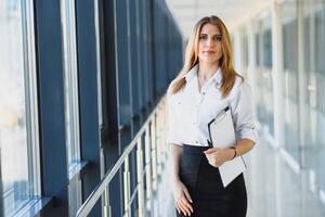 Modern business woman in the office with copy space photo