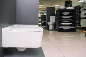 samples of modern sanitary ware for the toilet. new modern toilet in the plumbing store. photo