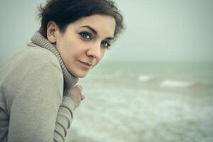 portrait of a beautiful woman at the sea photo