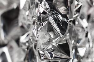 Full frame take of a sheeT of crumpled silver aluminum foil photo