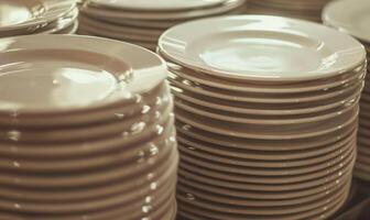 AI generated Close up of a stack of porcelain plates in a restaurant photo