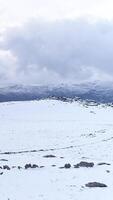 Vertical Video of Mountains Covered with Snow at Winter Time