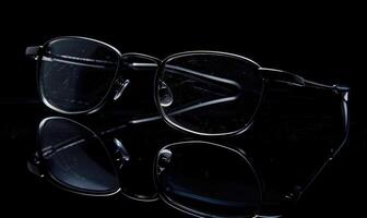AI generated Eyeglasses on a dark background, close-up. Selective focus. photo