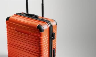 AI generated Orange suitcase on a gray background. photo