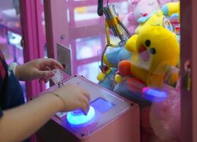 doll claw vender game arcade photo