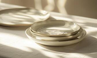 AI generated Set of silver round plates on a white fabric background. Selective focus. photo