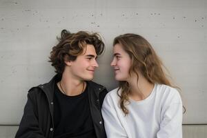 AI Generated Young Couple Exchanging Tender Glances Against a Concrete Background photo