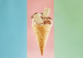 Scrumptious Ice Cream Cone with Wafer and Chocolate Isolated on a Multicolor Background photo