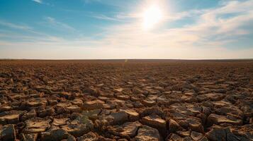 ai generado estéril campo extensión a el horizonte, el tostado tierra agrietado y seco debajo el implacable Dom foto