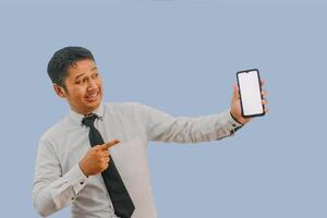 Side View A man showing excited while pointing to blank phone screen that he hold photo