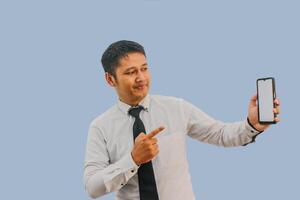 Side View A man showing excited while pointing to blank phone screen that he hold photo