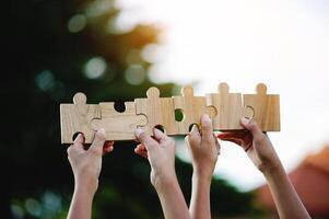 Jigsaw puzzle pieces of cooperation and teamwork Aim for great success in work. photo