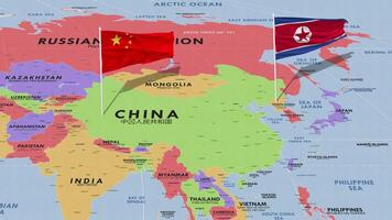 Cina e nord Corea bandiera agitando con il mondo carta geografica, senza soluzione di continuità ciclo continuo nel vento, 3d interpretazione video