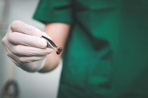 surgeon Remove the bullet from the patient's body in the operating room in the hospital. accident concept emergency surgery photo