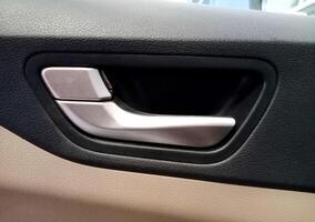 Closeup view of inner Car door Handle photo