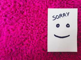 Sorry on sticky Note on fur texture background - Sorry Tag - Sorry Background photo