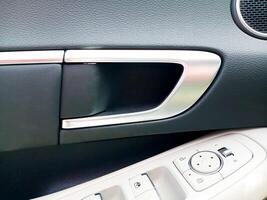 Closeup view of inner Car door Handle photo