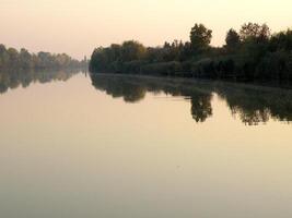 Autumn Colorful Trees Reflecting in Tranquil River photo