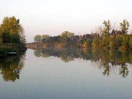 Autumn Colorful Trees Reflecting in Tranquil River photo