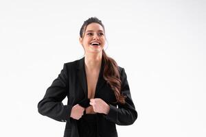 Young business woman arms crossed in black jacket standing studio isolated on white background photo