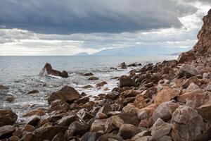 rock over the sea water photo