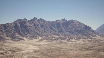 A mountain range in the middle of a desert video