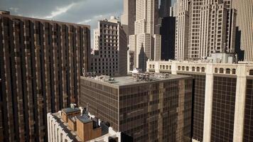 A cityscape with towering skyscrapers as seen from a rooftop video