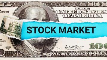 Stock Market. The word Stock Market in the background of the US dollar. Bullish and Bearish Trends in Financial Markets. Investment and Market Analysis Concept photo