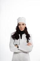 a woman in a white coat and hat photo