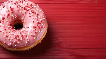 AI generated A pink frosted doughnut with sprinkles on top photo