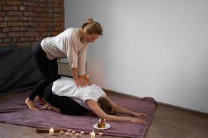 Relax and enjoy in spa salon, getting thai massage by professional masseur. photo