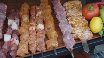 A tray of kebabs with meat and veggies a delicious dish on the table video