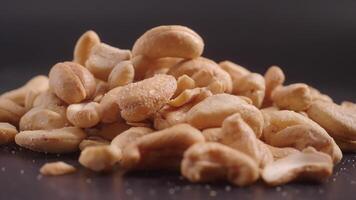 cashew nuts on black color background video