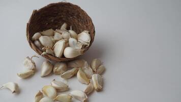 close up pf garlic on white background, video