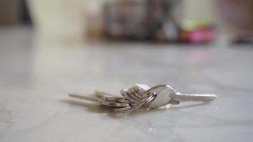 house keys on the ring on table in a room. To forget keys at home concept , video