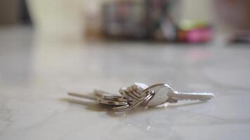 house keys on the ring on table in a room. To forget keys at home concept , video