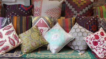 Colourful cushions on display for sale in a traditional Turkish Bazaar. video