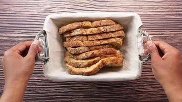 top view of men hand pick whole grain bread from a basket video