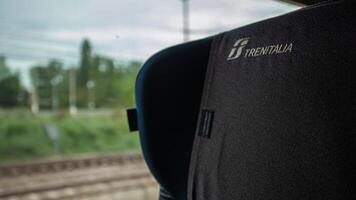 MODENA ITALY 01 OCTOBER 2020 Trenitalia logo Train seat detail near window during travel video