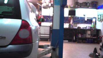MILAN ITALY 20 JANUARY 2020 Automobile on the lift in the workshop video